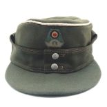 An Original German WW2 NSDAP Civic Police Officers M43 Cap. Small fabric tear at top of cap -