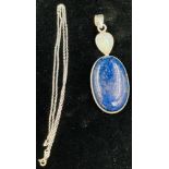 A Lapis Lazuli Pendant Set in 925 Silver. Comes on a disappearing silver necklace. 44cm and 4cm. 22g