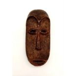 A 19th Century, carved ivory, mask from Lega tribe, Congo. Dimensions: 12.5 x 6 x 3 cm, weight: