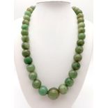 A Vintage Chinese 500ct Celadon Jade Graduated Bead Necklace. Largest central bead - 18mm