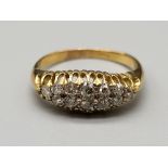 An 18 K yellow gold ring with a cluster of diamonds (some missing). Ring size: L, weight: 2.5 g.