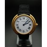 A Cartier Ellipse Ladies 18K Gold Automatic Watch. Black leather and gold strap with gold case -