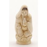 An antique, Japanese, carved ivory, figurine of a young lady in praying position. Height: 5 cm,