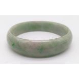 A Green Jade Bangle - 6.5cm inner diameter.