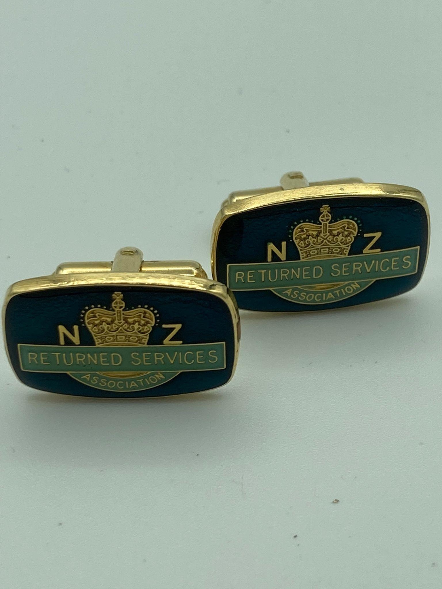 Pair of cufflinks showing New Zealand returned Services Association. Gold tone with attractive