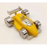 A YELLOW RACING CAR CLOCK FROM ICON DIRECT LTD IN ORIGINAL BOX WITH INSTRUCTIONS