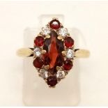 A 9K Yellow Gold Ruby and Diamond Cluster Ring. Size M. 2.9g