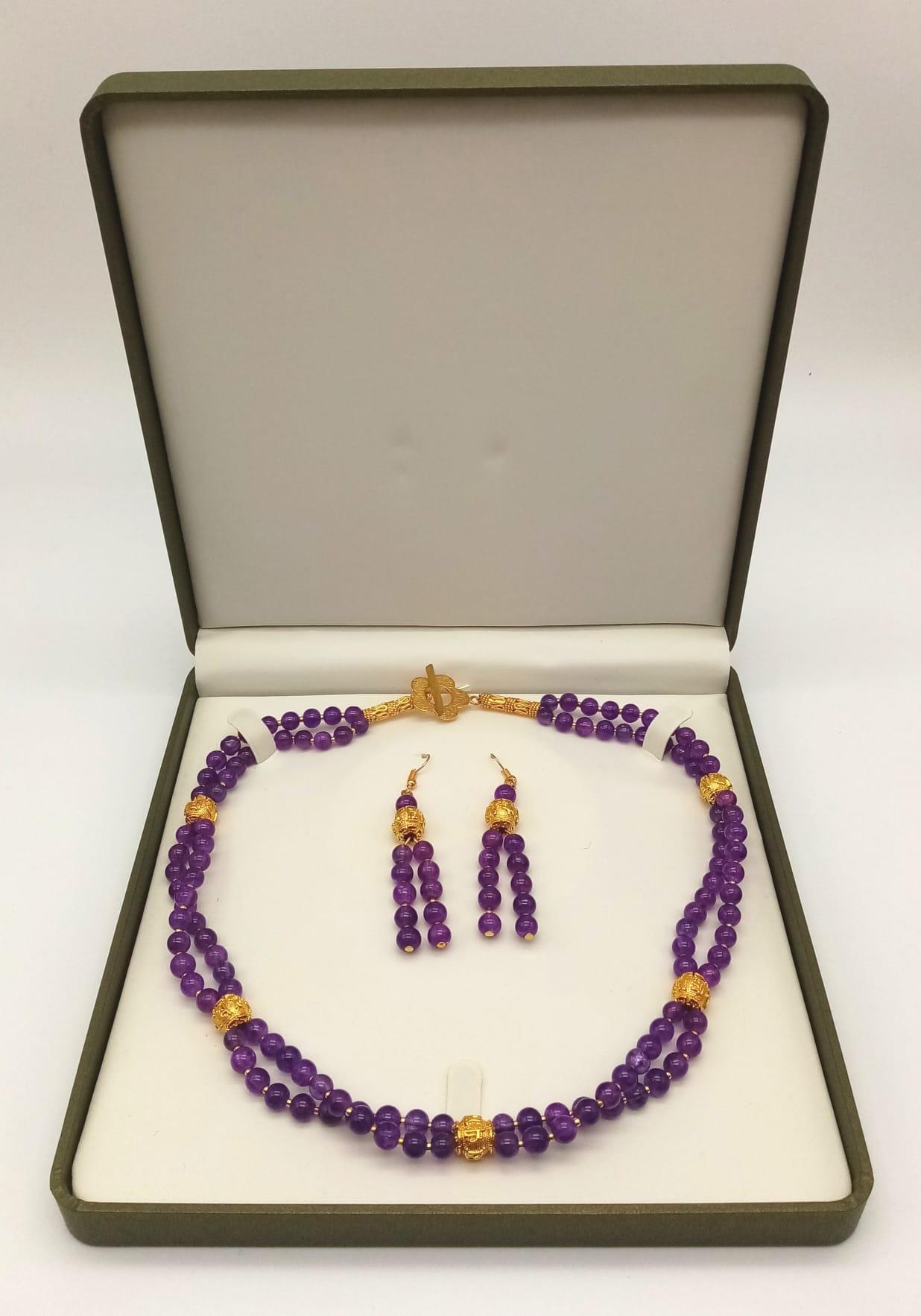 A double row of round amethysts necklace and earrings set with 18 K yellow gold plated highlights. - Image 12 of 12