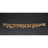 A Vintage 9K Yellow Gold Charm Bracelet. 26 Charms. 19cm. 18.65g