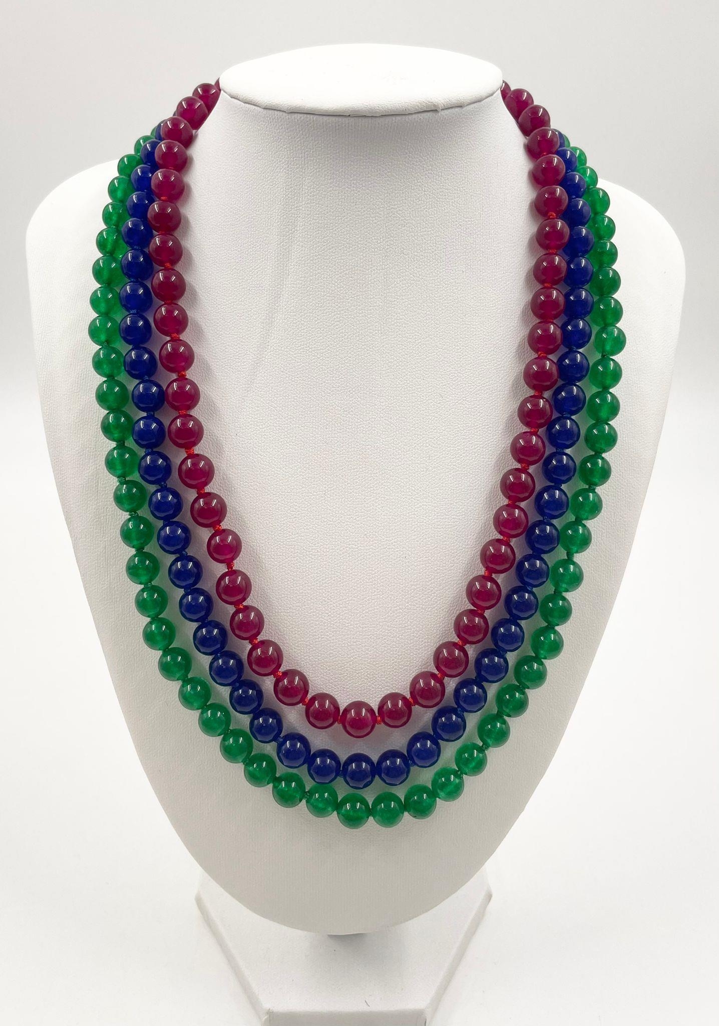 A Sensational 600ct Natural Emerald, Ruby and Sapphire Three-Row Smooth-Bead Necklace. Silver-