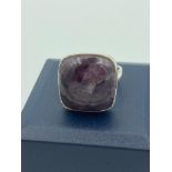 SILVER RING stone set with large polished Charoite in square mount. Inside band showing 925 silver