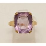 A 9K Yellow Gold Amethyst Ring. Emerald cut centre stone. Size N. 2.85g