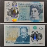 A 2015 Cleland First Run Five Pound Note. AA01 229633-B414. Uncirculated condition in a plastic