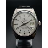 A Rolex Oyster Perpetual Gents Watch. Stainless steel strap and case - 35mm. White dial with date