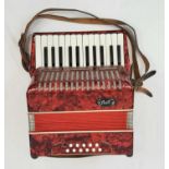 A Vintage German Bell Accordion. Comes complete with original hard case. 31 x 35cm. In good