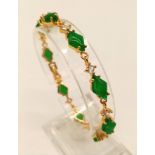 A Jade and White Stone Bracelet on Yellow Metal. 18cm.