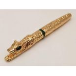 A heavy, luxuriously 18 K yellow gold plated pen in the style of Cartier Panther. In a