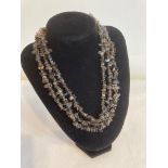 Three row SMOKY QUARTZ NECKLACE having stones mounted in coral cut style with solid silver clasp