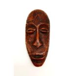 A 19th Century, carved ivory mask from Lega tribe, Congo. Height: 15.5 cm, width: 7 cm, weight: