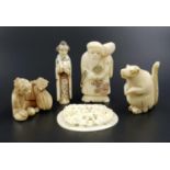 Collection of 5 antique Japanese figurines, featuring a man and one Geisha, one signed netsuke, an