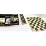 A WOODEN GAMES CONPENDUIM, BACKGAMMON, DRAUGHTS, CHESS, DOMINOES AND PLAYING CARDS. IN A FAUX