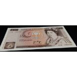 A 1975 Page Ten Pound Note First Series Serial Number. B330. A09 183335. Uncirculated condition in a