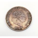An 1818 George III Silver Half Crown Coin. Condition as per photos. 14g.