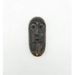 An Antique African 19th Century Ivory Mask - From the Luba Tribe (Congo). 13 x 7cm. 115g