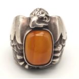 An Early and Rare Native American Silver Agate Ring. Oval centre stone surrounded by an eagle.