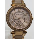 A Michael Kors Ladies Gold Plated Chronograph Dress Watch. Case - 32mm, with white stones on