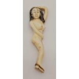 A 19th Century Japanese, carved ivory figure of a naked lady, wearing her shoes. Height: 9.7 cm,