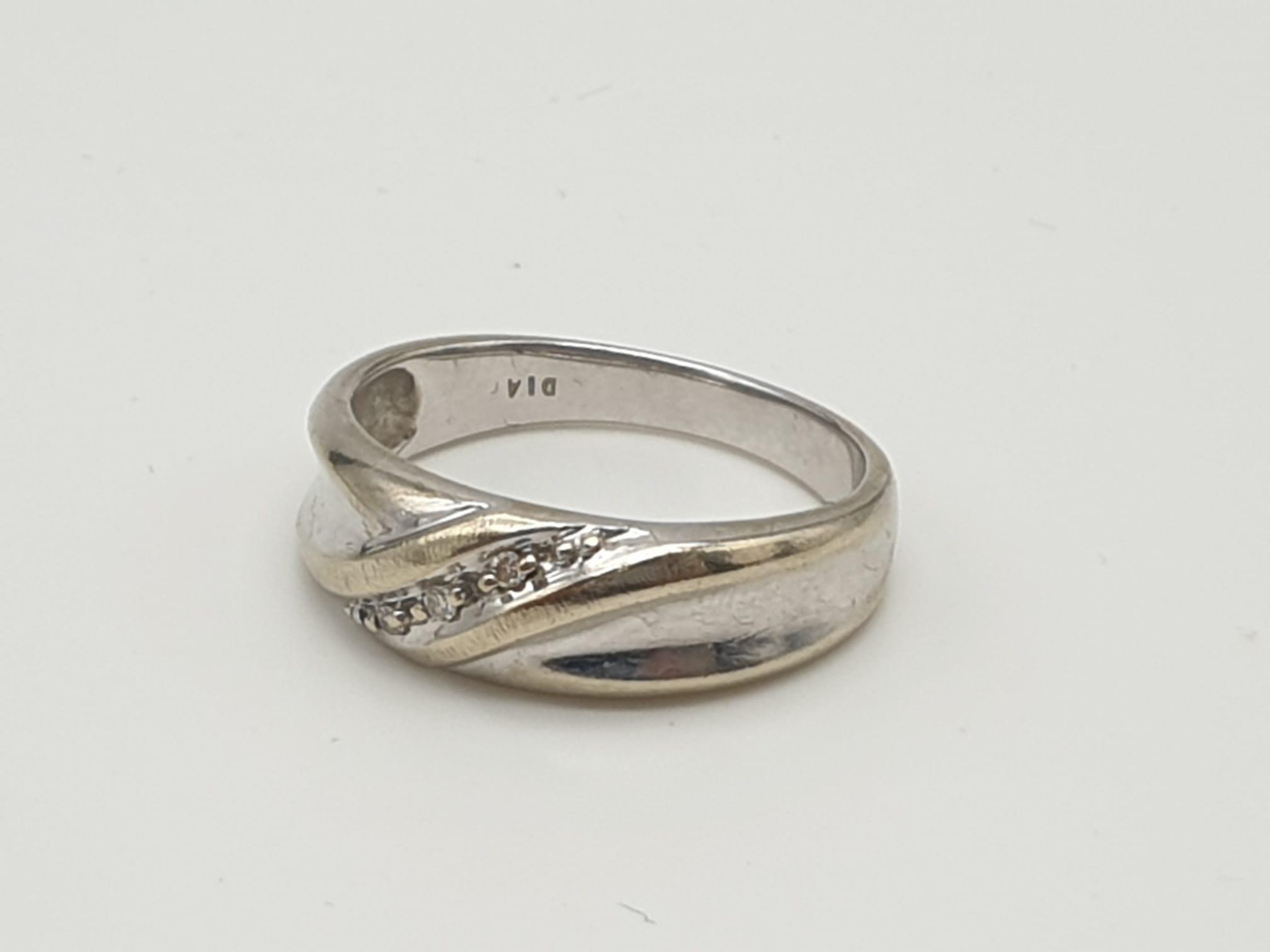 A 9 K white gold ring with a crossing over band of diamonds. Ring size: S, weight: 4.3 g. - Image 3 of 13