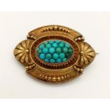 A Victorian, 9 K yellow gold and turquoise brooch. Dimensions: 40 x 29 x 15 mm. Weight: 10.4 g.