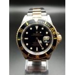 A Rolex Submariner Automatic Gents Watch. 18K Gold and stainless steel strap and case - 40mm.