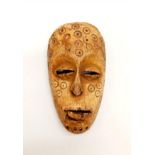A 19th Century African carved ivory mask from Songye tribe, Congo. Dimensions: 12 x 7 x 3.5 cm,