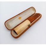 A Late Victorian amber and ivory cheroot pipe in original custom made leather case. Length: 9.5 cm