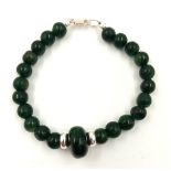 An African Jade 925 Silver Bracelet. 7mm jade beads with a large 15 x 10mm wheel central bead.