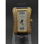 A Carl F. Bucherer 18K Gold and Diamond Ladies Quartz Tank Watch. Black leather and 18k Gold