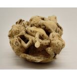 A 19th Century carved ivory netsuke with a group of frogs. Dimensions: 6 x 3.5 x 2 cm, weight: 26 g.