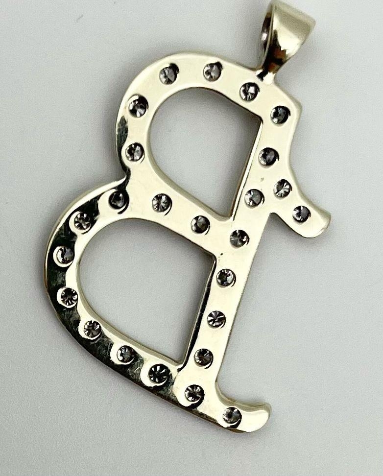 An 18K White Gold (tested) and Diamond Letter B Pendant. 3.25g. 35mm. - Image 2 of 3
