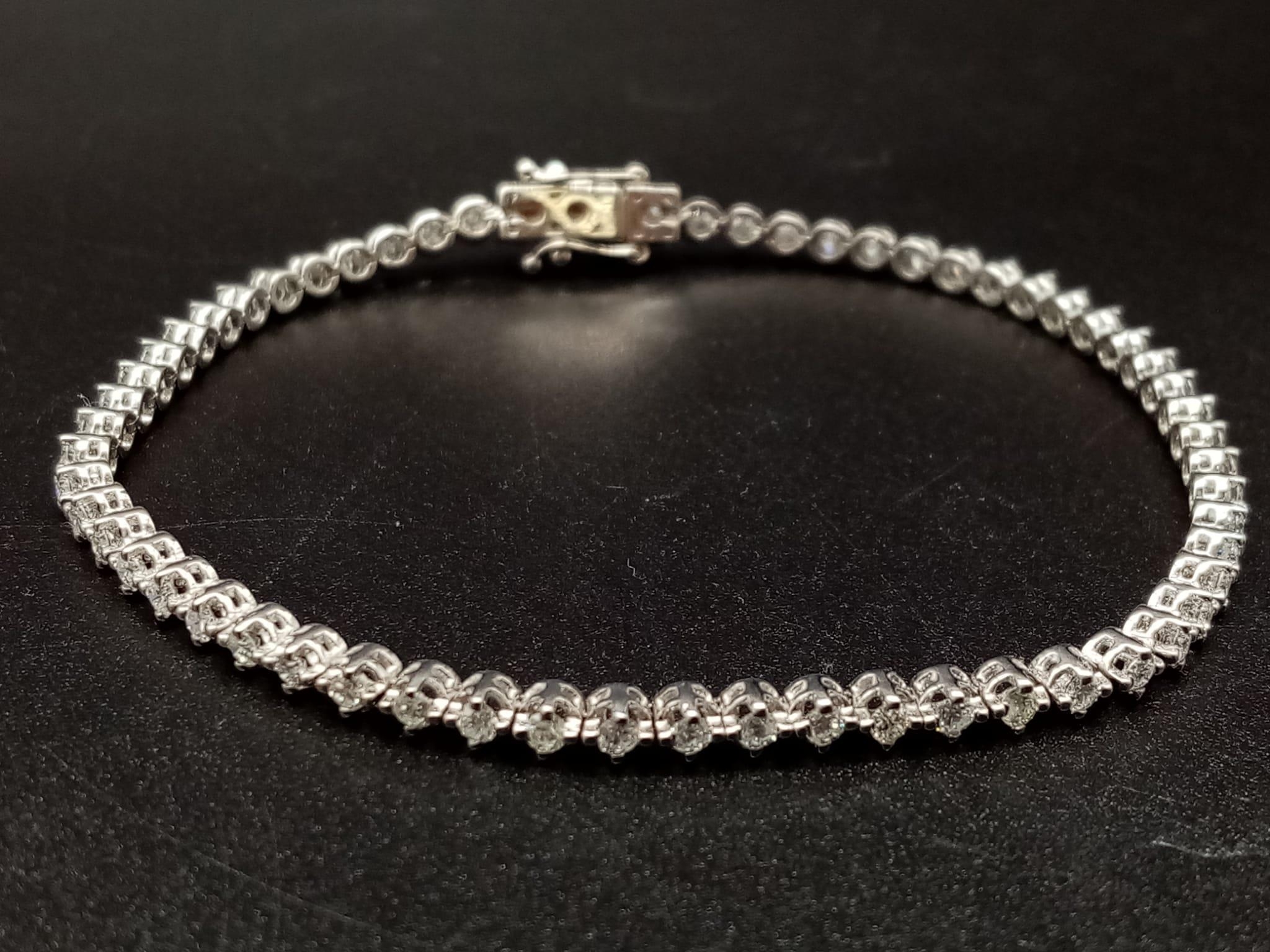 An 18K White Gold Diamond Tennis Bracelet. 2.3-2.5ct. I - VS Grade. 8.31g. 18cm.