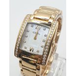 AN EBEL BRASILIA 18K GOLD LADIES WATCH WITH CHANNEL SET DIAMONDS AND NUMERALS IN TANK STYLE . 24 X
