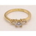 An 18K Yellow Gold Three-Stone Diamond Ring. 0.60ct. Size N. 3g.