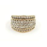 AN 18K YELLOW GOLD DRESS RING ENCRUSTED WITH QUALITY DIAMONDS. 9.1gms size N