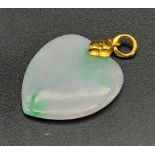 A Jade Heart Pendant Set in a 24k Yellow Gold Attachment. 3cm. 5.61g total weight.