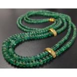 A Two Row Natural Emerald Bead, 18K Yellow Gold and Diamond Necklace. 18k Yellow gold clasp with two