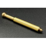 A late Victorian or Edwardian 18 K yellow gold and bone mechanical propelling pencil. Tip parts