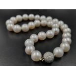 A Glamorous South Sea Silver-Grey Pearl Necklace with 18k White Gold and Diamond Clasp. Graduating