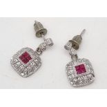 A Pair of 14K White Gold Ruby and Diamond Earrings. 12 x 12mm. 4.5g