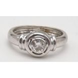 An 18K White Gold Diamond Solitaire Ring. Round cut diamond - 0,60ct. J-SI Grade. Size O. 5.5g.
